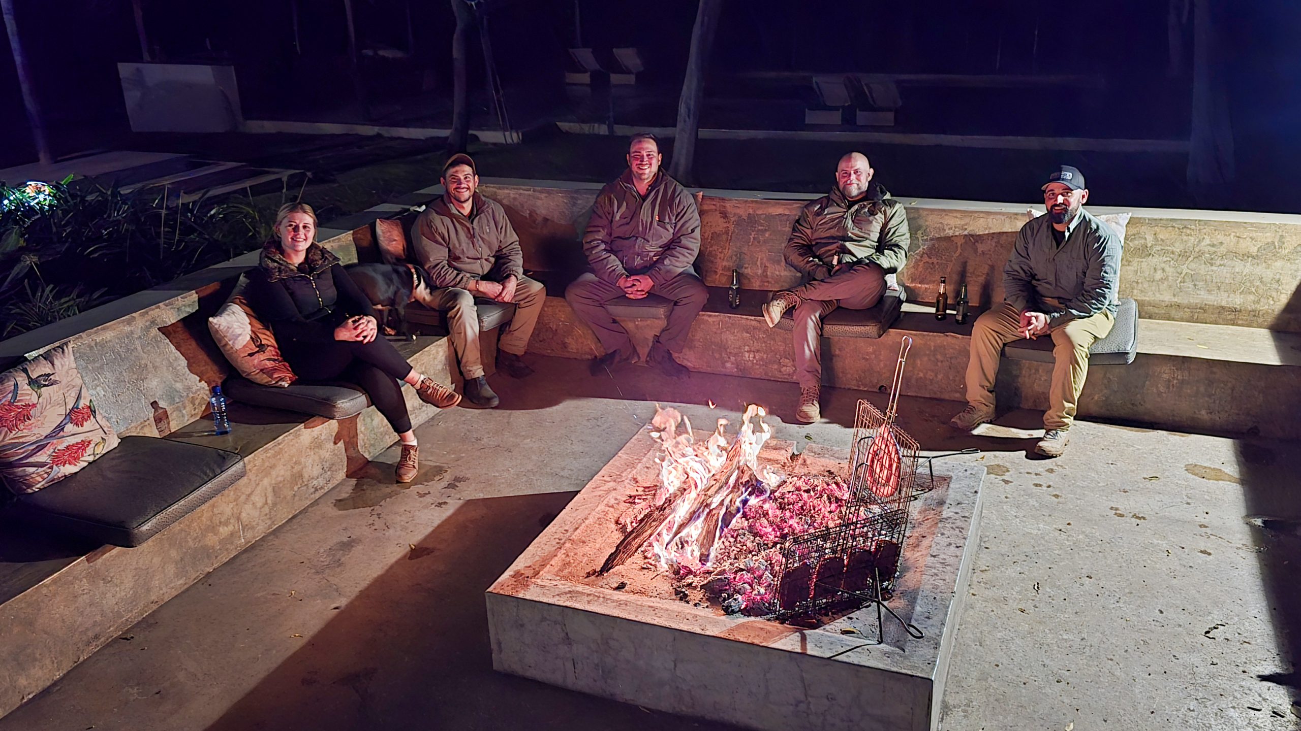 Guests gathered around a fire at Langkloof
